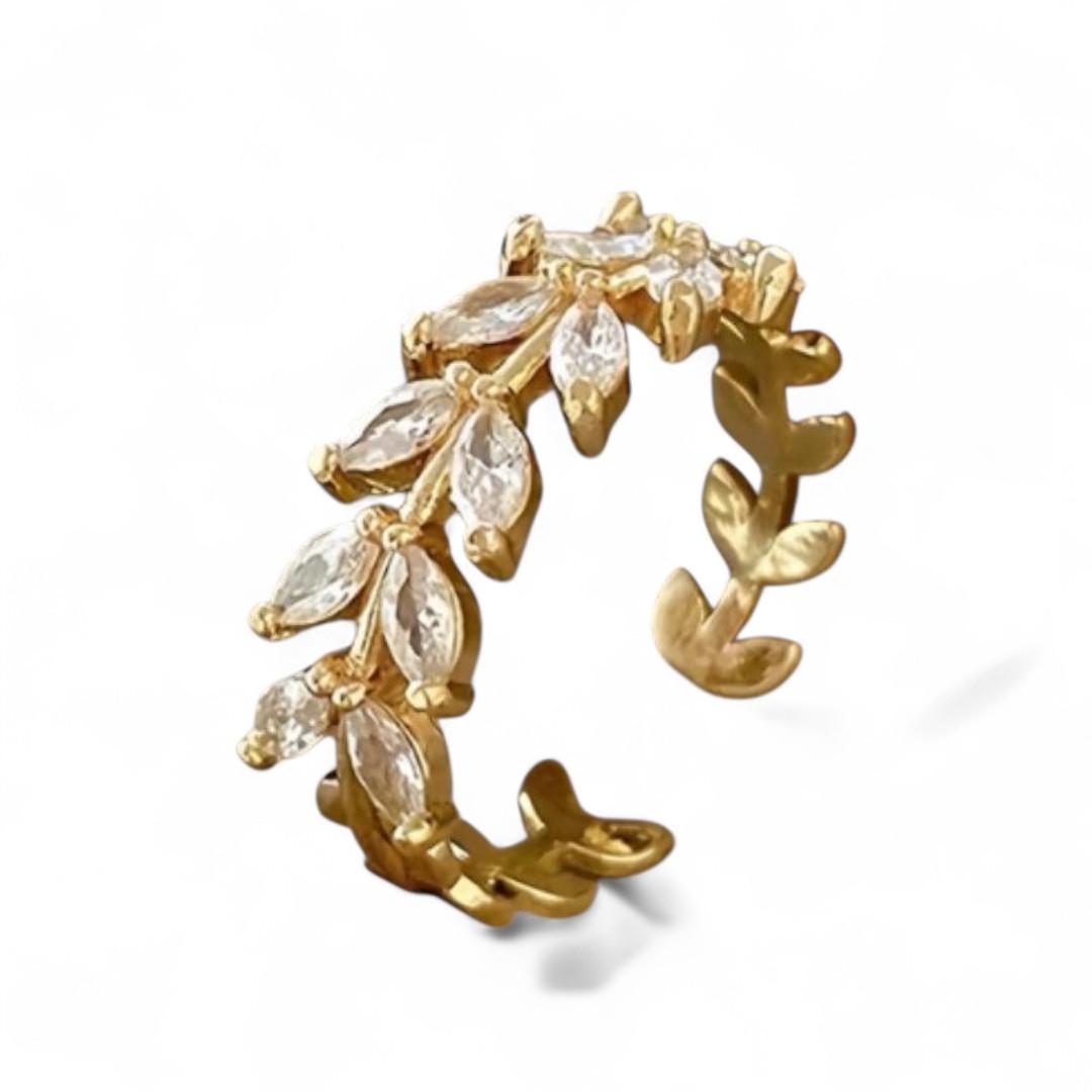 APZELTĪTS GREDZENS AR LAPĀM UN CAURSPĪDĪGU KUBISKO CIRKONIJU