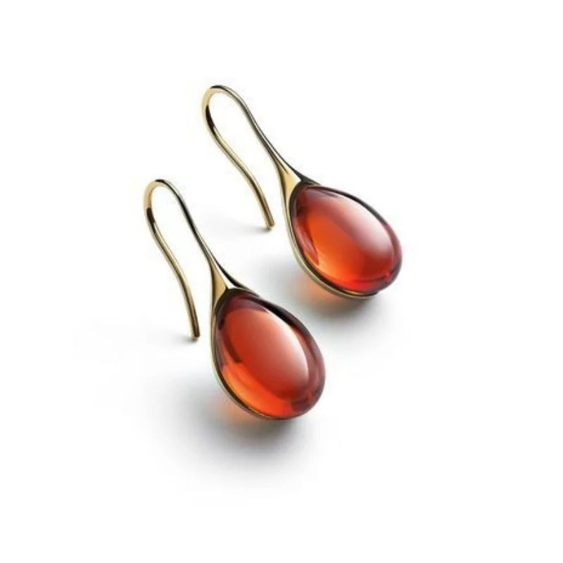 ZELTA TOŅA AUSKARI AR STIKLA LĀSES KULONIEM