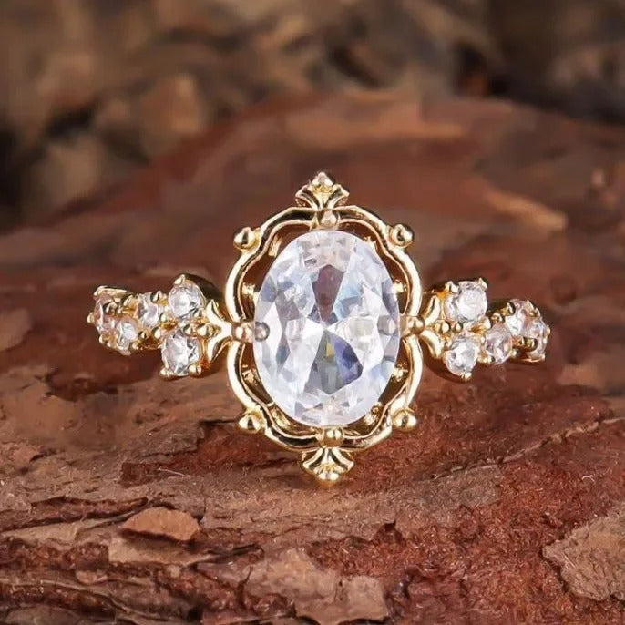 ZELTA TOŅA GREDZENS AR OVĀLU KUBISKO CIRKONIJU